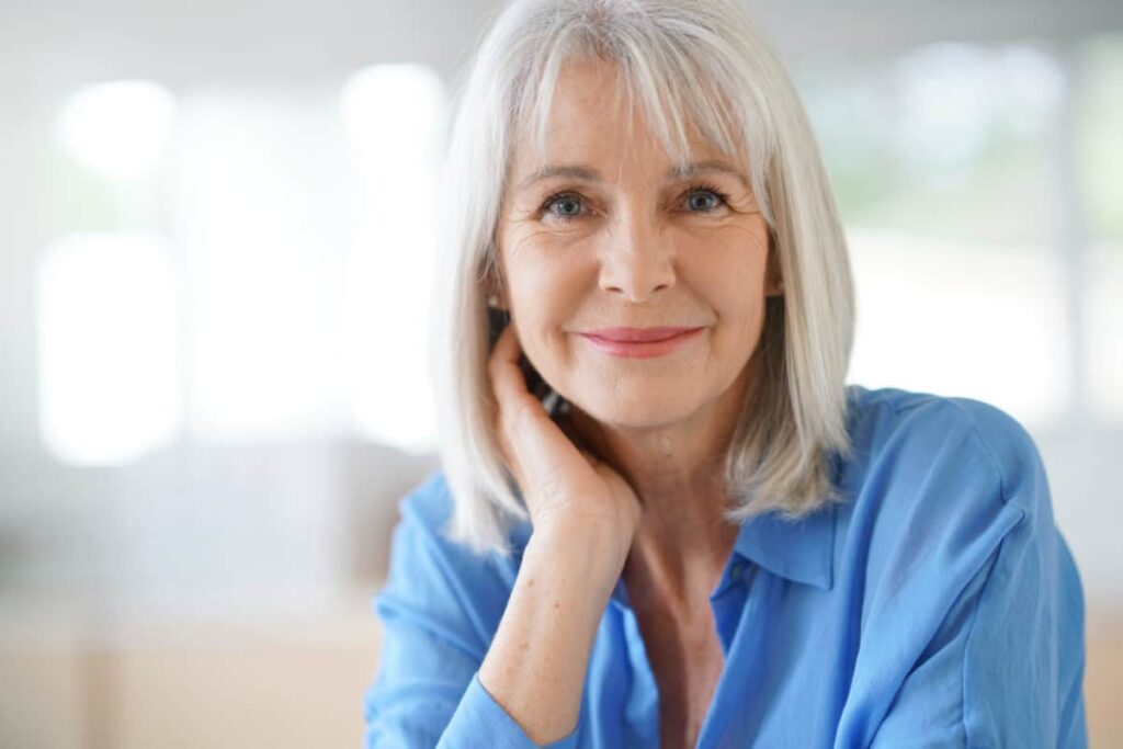 Portrait of senior woman with blue shirt